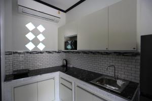 ครัวหรือมุมครัวของ MB House Resort