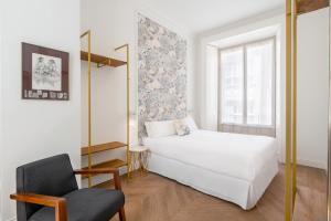 A bed or beds in a room at Be Mate Málaga Centro