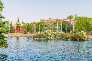 a body of water with flags and flowers at ALEGRIA ID118 in Torrevieja