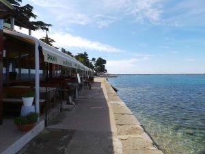 a train station next to a body of water at Apartment Crikvenica, Vinodol 2 in Crikvenica