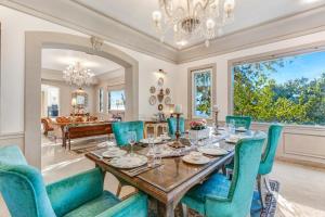 a dining room with a table and chairs at SaffronStays Naiintara in Nainital +64 photos