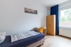 Postel nebo postele na pokoji v ubytování Pension für Monteure in Leipzig