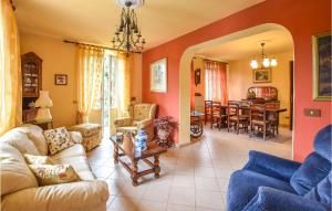 a living room with a couch and a table at Casa Le Vallette in Massarosa