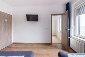 TV a/nebo společenská místnost v ubytování Pension für Monteure in Leipzig