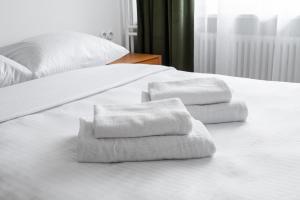 Posteľ alebo postele v izbe v ubytovaní Kopernika City Centre Apartment