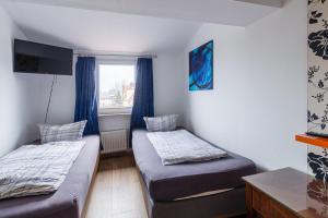 Postel nebo postele na pokoji v ubytování Pension für Monteure in Leipzig