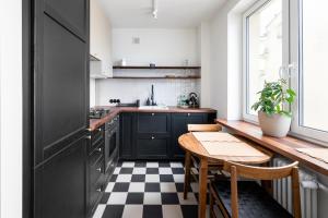 Kuchyňa alebo kuchynka v ubytovaní Kopernika City Centre Apartment