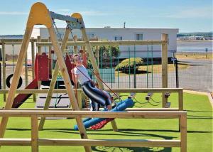 a young girl playing on a playground at Ryan Bay in Dunragit