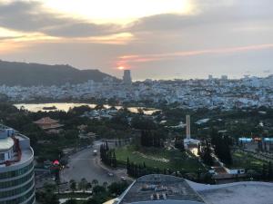 a view of a city at sunset from a building at The Song Apartment Vung Tau Sea view in Vung Tau