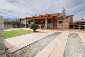 a house with a patio in front of it at Can Ricart in Puigcerdà