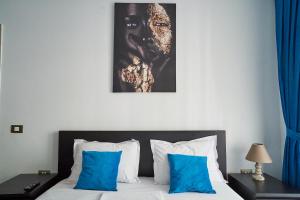 En eller flere senge i et værelse på Bianca Residence 2 by Alz