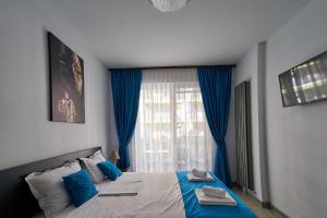 En eller flere senge i et værelse på Bianca Residence 2 by Alz + 49 billeder