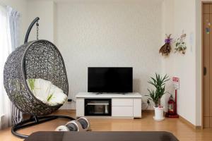 TV a/nebo společenská místnost v ubytování ICOI/怡香居/憩い（大阪市内、無料駐車場付き、難波、心斎橋電車で10分）