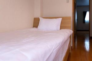 Postel nebo postele na pokoji v ubytování ICOI/怡香居/憩い（大阪市内、無料駐車場付き、難波、心斎橋電車で10分）
