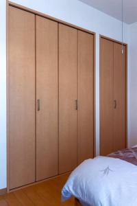 Postel nebo postele na pokoji v ubytování ICOI/怡香居/憩い（大阪市内、無料駐車場付き、難波、心斎橋電車で10分）