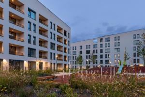 a view of two buildings in a courtyard at Streams Apartment with Garden and Free Parking in Trnava