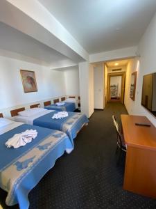 Hotel Frankoni tesisinde bir odada yatak veya yataklar