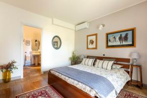 Postel nebo postele na pokoji v ubytování B&B La Casetta di Ben