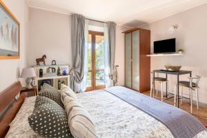 Postel nebo postele na pokoji v ubytování B&B La Casetta di Ben