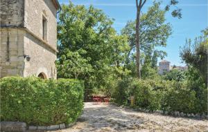 an external view of a house with bushes and trees at 3 Bedroom Gorgeous Home In Barjac in Barjac