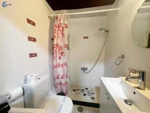 a bathroom with a shower and a toilet and a sink at Gtrip Monastiraki Cosy Apartment - 5026 in Athens