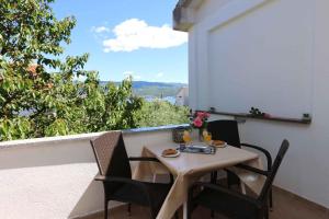 a table and chairs on a balcony with a view at Apartment in Silo/Insel Krk 14599 in Šilo