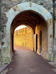 an archway in a building with a brick wall at Romantic Royal Windsor in Windsor