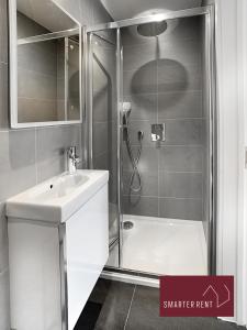 a bathroom with a shower and a sink at Eton, Windsor - 2 Bedroom Second Floor Apartment - With Parking in Eton