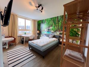 1 dormitorio con 1 cama y un mural de una cascada en Gery's Camp, en Lucerna