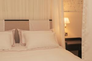 Postel nebo postele na pokoji v ubytování Magda Boutique Rooms