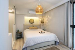a bedroom with a large white bed in a room at EF apartment in Corfu Town