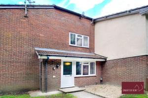 a brick house with a white door and a window at Farnborough - Lovely 1 Bedroom House in Blackwater