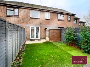 a brick house with a yard in front of it at 2 Bed House with Garden, Woking in Chobham