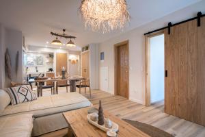 a living room with a couch and a table at EF apartment in Corfu Town