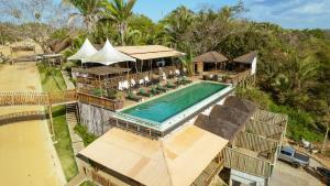 an aerial view of a resort with a swimming pool at Pousada Praia do Funil in Lajeado