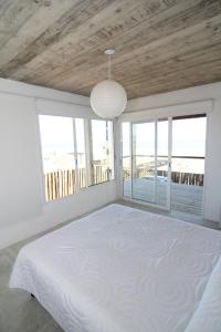 Ένα ή περισσότερα κρεβάτια σε δωμάτιο στο Ménage à Trois