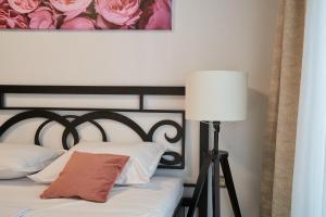 En eller flere senge i et værelse på Bianca Residence 3 by Alz