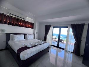 Voodi või voodid majutusasutuse Manarra Sea View Resort toas