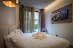 Posteľ alebo postele v izbe v ubytovaní Hotel Vinci