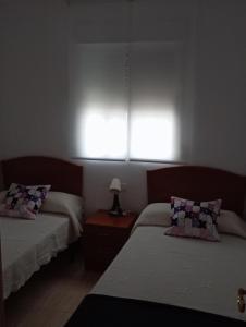Łóżko lub łóżka w pokoju w obiekcie Apartamento de 2 dormitorios en Magic World, Marina D'or