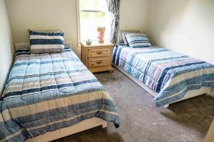 Un pat sau paturi într-o cameră la 171 Port Matilda