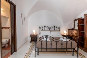 Postel nebo postele na pokoji v ubytování Casa Celidonia
