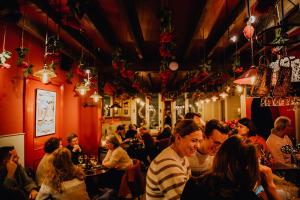a group of people sitting in a restaurant at Hotel Rose Red in Bruges +246 photos