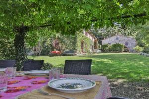 a table with a plate of food on it in a yard at Villa Casanova by Mmega in Cerbaiolo +24 photos