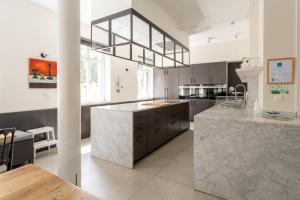 a large kitchen with a large island in the middle at Domaine St Roch in Couvin