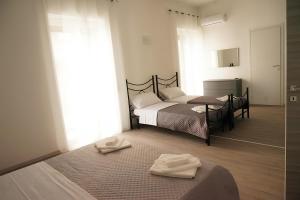 A bed or beds in a room at LA RESIDENZA DI ADAMO