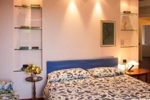 Ένα ή περισσότερα κρεβάτια σε δωμάτιο στο Villa Ametista