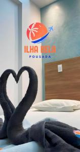מיטה או מיטות בחדר ב-Pousada Ilha Bela