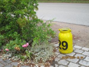 a yellow pot sitting on the side of a street at Radlerhaus Prora in Prora