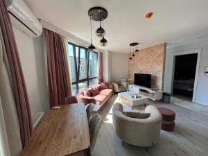 a living room with a couch and a table at E5 Deluxe in Istanbul